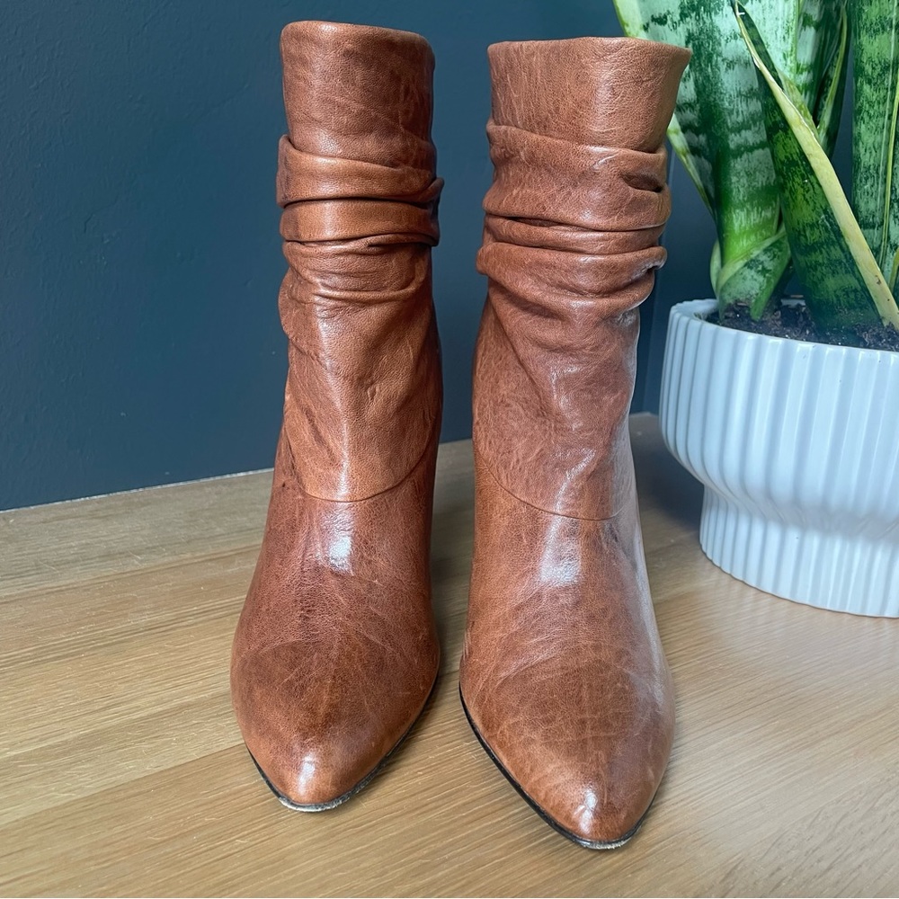 BCBGMAXAZRIA brown leather high heeled booties.